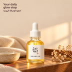 Beauty of Joseon Glow Serum on a wooden shelf with a folded towel and dried flowers