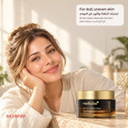 Woman with highlighted hair resting her cheek on her hand beside the Medicube Deep Vita C Capsule Cream jar
