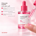 Dropper releasing a drop of Medicube TXA Niacinamide 15 Serum onto a fingertip