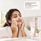 Woman in a robe with cleansing foam on her face beside the SKIN1004 Poremizing Deep Cleansing Foam