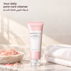 SKIN1004 Poremizing Deep Cleansing Foam on a counter next to a bowl of pink salt and a white towel